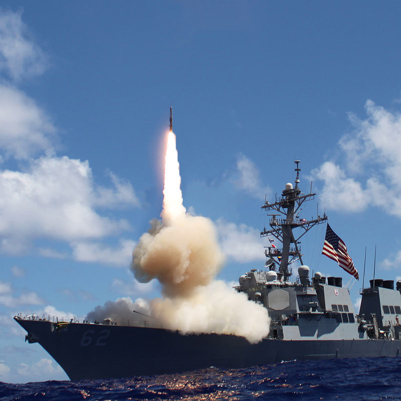 A missile is launching from a warship.
